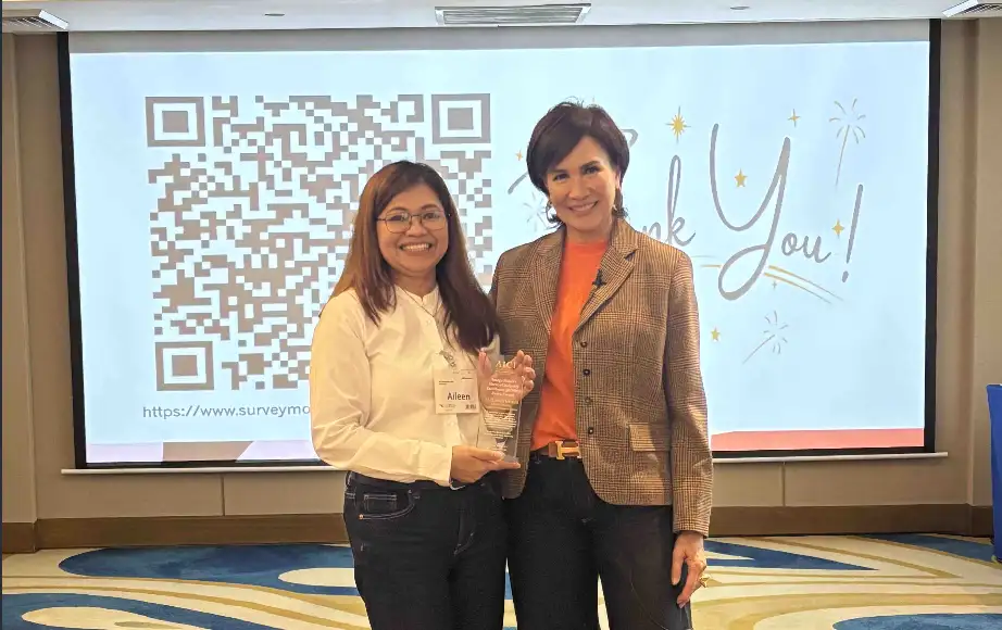 Eastern Communications Co-Coordinator Atty. Aileen Regio receives the ...